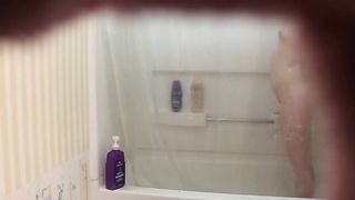 Hardly eighteen doll is having a douche not knowing that her step-step-brother is eyeing her