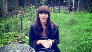 Naked girl at work. Changing a tire on the car shaking her big boobs