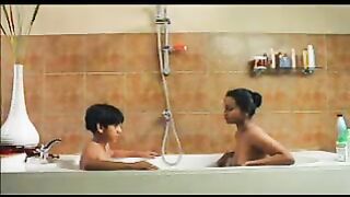Young Son in the Bathtub with Mom. She Tells him Important Secrets