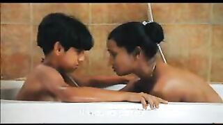 Young Son in the Bathtub with Mom. She Tells him Important Secrets