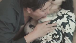 While the husband sleeps in a wheelchair, the wife and her lover caress each other